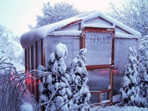Our redwood climate controlled greenhouse kits are perfect for gardening in the snow.